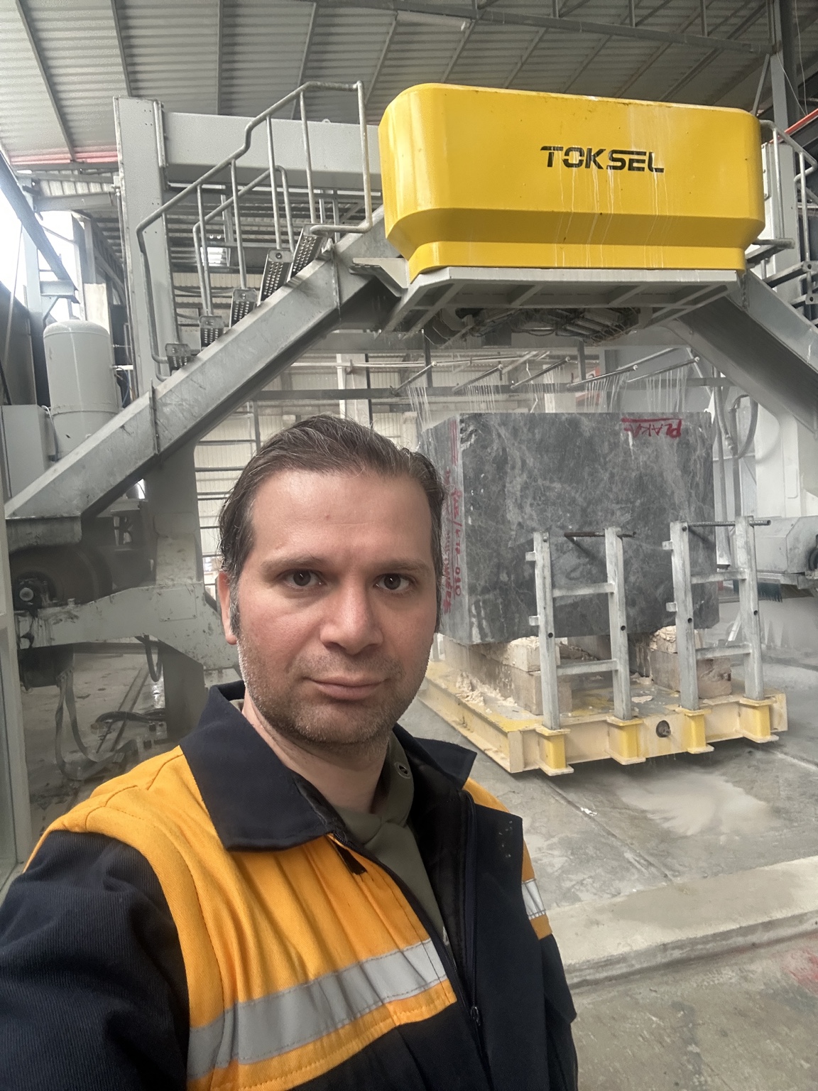 Ehsan Roshani beside the TOKSEL machine